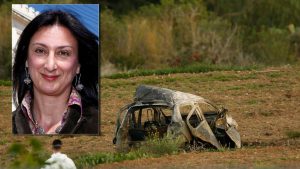 A forensics expert walks in a field after a powerful bomb blew up a car (Rear) killing investigative journalist Daphne Caruana Galizia in Bidnija, Malta, October 16, 2017.