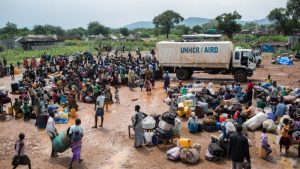 South Sudanese refugees gather at a UNHCR collection centre on the South Sudan border in Egelo, Uganda.